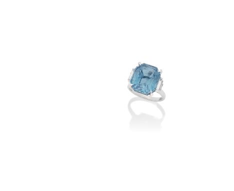 ART DECO AQUAMARINE AND DIAMOND RING, CIRCA 1935The octagonal step-cut aquamarine, weighing 12.07 carats, between tiered bagu