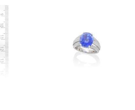 BOODLES: SAPPHIRE AND DIAMOND DRESS RINGThe cushion-shaped sapphire, weighing 9.75 carats, between trifurcated shoulders set 