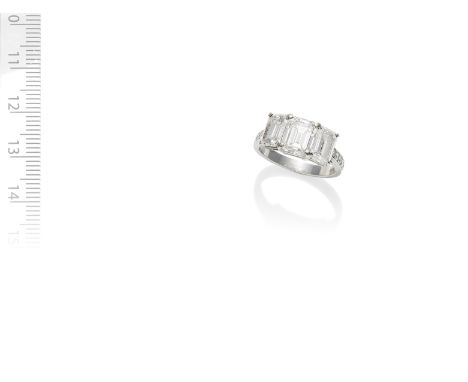 BOODLES: DIAMOND THREE-STONE RINGThe three step-cut diamonds, weighing 1.41, 1.45 and 1.41 carats, between brilliant-cut diam