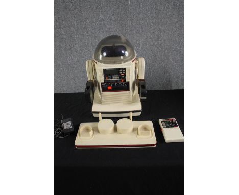 A 1980s Omnibot Robot made by Tomy. Boxed. Untested. Radio controlled and complete with tray. H.46 W.38 D.41cm. (box). 