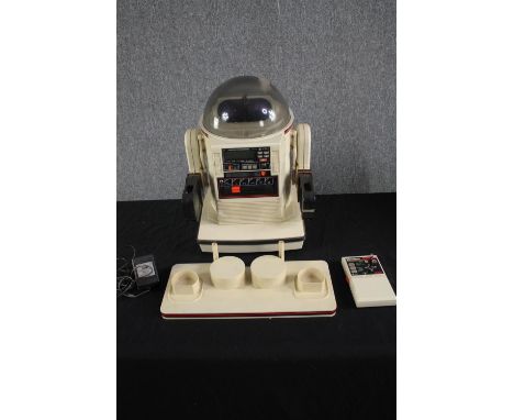 A 1980s Omnibot Robot made by Tomy. Boxed. Untested. Radio controlled and complete with tray. H.46 W.38 D.41cm. (box). 