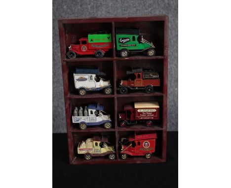 Oxford Diecast. A collection of eight 'vintage model' cars. In a wooden display case. H.31 W.21cm. (box) 