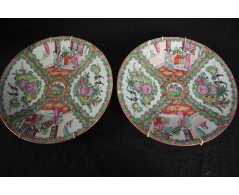 Two hand painted Chinese green famille plates. With a makers seal on the base (faint) and evidence of past repairs. Early twe