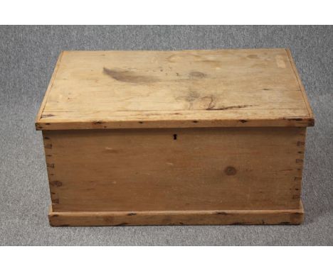 A 19th century pine travelling trunk. H.40 W.82 D.54cm. 