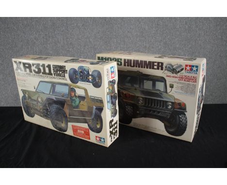 Tamiya. Model cars. The XR311 Combat Support Vehicle and the M1025 Hummer. Unmade 1/12 scale kits. H.57 W.37cm. (each) 