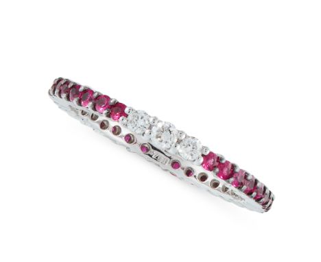 A RUBY AND DIAMOND ETERNITY RING in 18ct white gold, designed as a full eternity, set with round cut rubies and three round c