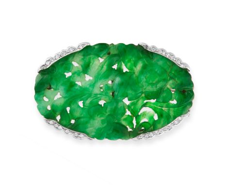 A CARVED JADEITE JADE AND DIAMOND BROOCH in 18ct white gold, set with an oval jadeite plaque, carved in detail to depict flow