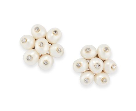 A PAIR OF PEARL AND DIAMOND FLOWER EARRINGS in 18ct white gold, designed as a flower, each comprising of a cluster of seven p