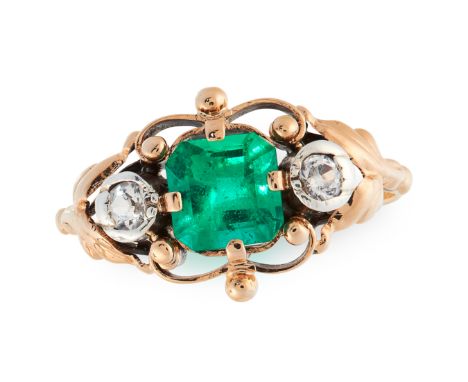 A COLOMBIAN EMERALD AND DIAMOND RING, CIRCA 1945 in 18ct yellow gold, set with an octagonal cut emerald of 1.31 carats in a s