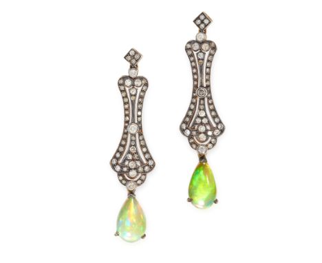 A PAIR OF OPAL AND DIAMOND DROP EARRINGS the elongated scrolling body is set with round cut diamonds and suspends a pear cabo