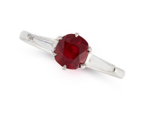 A RUBY AND DIAMOND RING set with a cushion cut ruby of 1.16 carats between two tapered baguette cut diamonds, unmarked, size 
