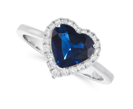 A SAPPHIRE AND DIAMOND DRESS RING in 18ct white gold, set with a heart cut sapphire of 1.85 carats in a border of round cut d