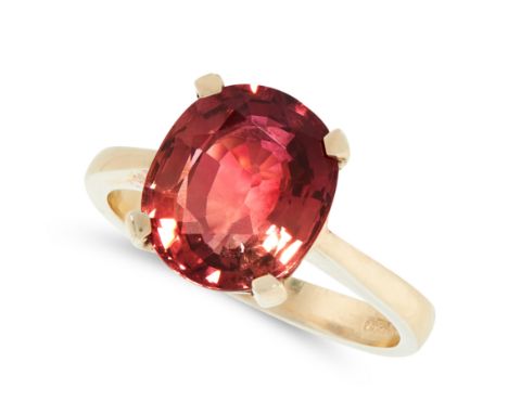 A PINK TOURMALINE DRESS RING in yellow gold, set with an oval cut pink tourmaline of 3.40 carats, full British hallmarks, siz