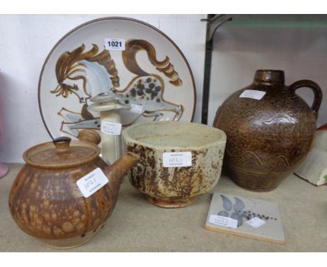 Six pieces of studio pottery including Greyshott horse pattern plate, Winchcombe flagon, cut sided bowl, etc.