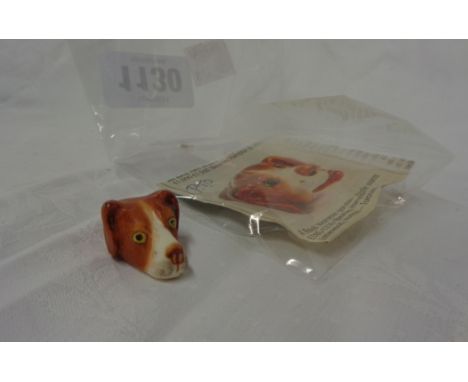 A Royal Worcester dog's head pattern whistle