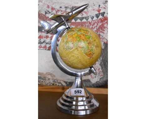 A small reproduction globe with aeroplane finial