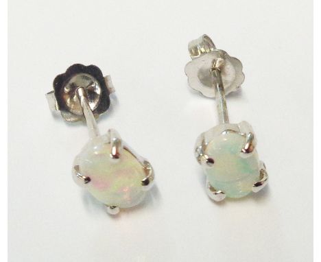 A boxed pair of white metal small opal stud ear-rings