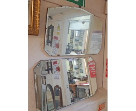 Two vintage frameless bevelled wall mirrors, both with shaped plates