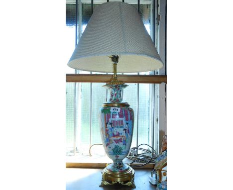 A gilt brass mounted Chinese Famille Rose lamp with shade