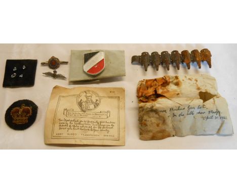 Two Second World War battlefield relics, an Army Blood Transfusion Service B.T.27 certificate, an R.A.S.C. sweetheart badge a