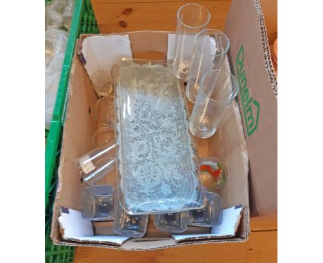 A box containing assorted glassware and collectable items, including vintage printed and other examples