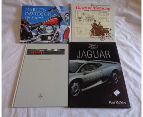 A small collection of automobila related books and ephemera including Harley Davidson, Jaguar, etc.