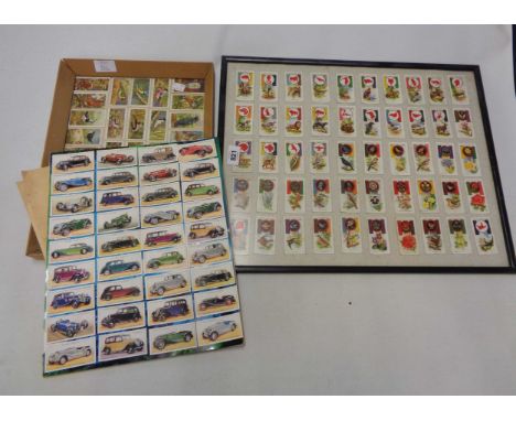 Two framed sets of cigarette cards, board mounted set of stuck down automobile cards and some loose cards
