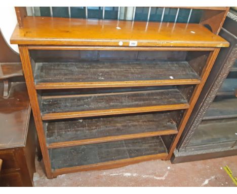 A 1.10m old oak four shelf open bookcase with moulded decoration