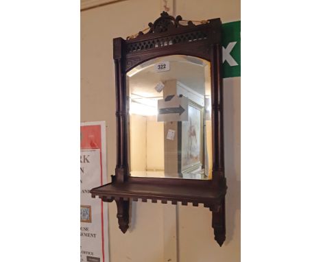 An Edwardian stained walnut framed mirror backed wall shelf with bevelled plate and pierced decoration - shelf gallery missin