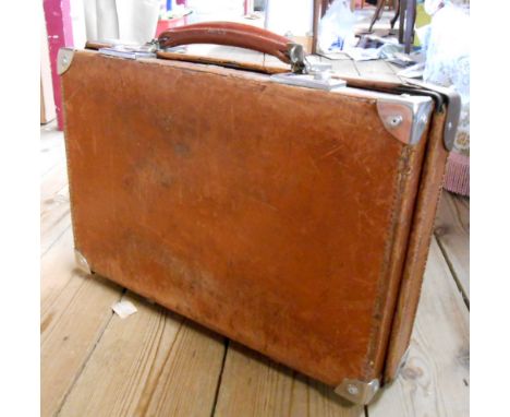 A vintage small Revelation leather suitcase