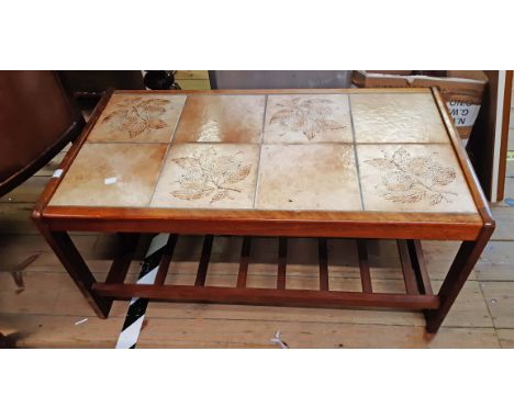 An 85cm vintage teak framed coffee table with tile inset top and slatted undertier, set on moulded supports