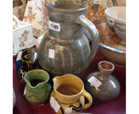 Six pieces of Cricklade Pottery ware including large jug, bird decorated wall pocket, jugs, and a vase