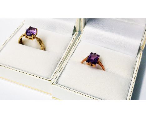 An import marked 375 gold amethyst ring 'ANUL AUTRE' inside shank - sold with a rose metal amethyst style ring - both boxed