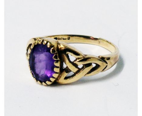 An import marked 375 Celtic style ring, set with oval amethyst - boxed