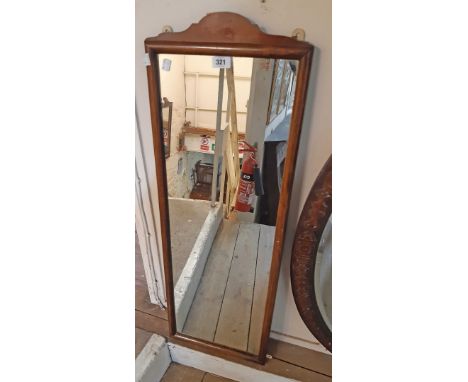 A 35cm wide vintage stained wood framed narrow oblong wall mirror