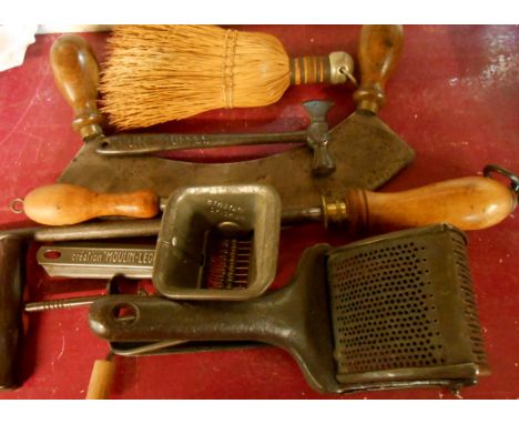 A quantity of kitchenalia and tools including herb chopper, potato ricer, corkscrew, etc.