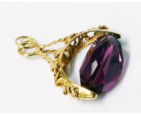 A hallmarked gold and amethyst swivel fob - marks worn