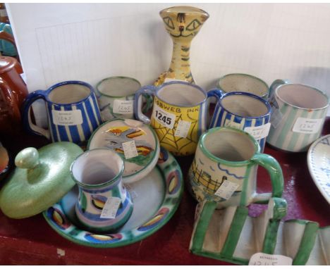 Twelve pieces of vintage Tintagel pottery including toast rack, pub and other mugs, cat vase, etc.