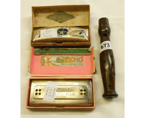 A vintage boxed M. Hohner Echo-Luxe harmonica, and a similar Echo - sold with a turned rosewood pocket recorder