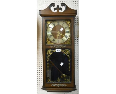 A President polished wood cased wall clock with visible pendulum and gong striking movement