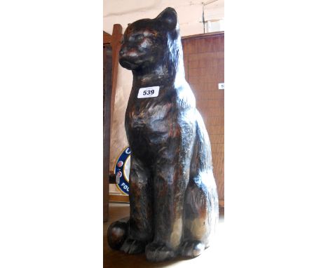A large vintage carved wood cat with bronzed finish