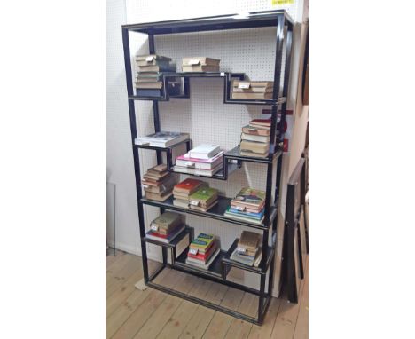 A 1m vintage Pierre Vandel (Paris) display unit with gilt lined black painted finish and stepped shelving with black painted 