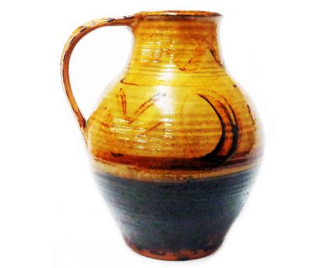 Michael Cardew: a Winchcombe Pottery jug of bulbous form with spoutless neck, brown slip and painted chevron decoration
