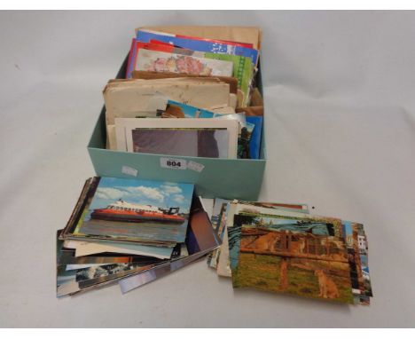 A box containing a collection of 20th Century postcards, numerous posted envelopes, Kodak filters, 1970s football related pub