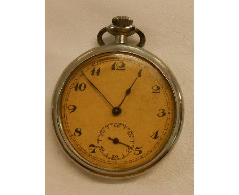 A carved pine Black Forest style watch stand containing a vintage pocket watch