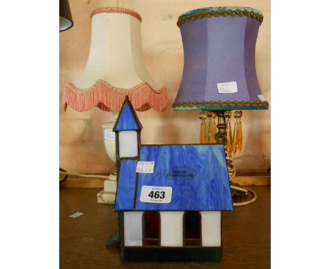 A modern stained glass lamp in the form of a church - sold with a gilt metal lustre drop table lamp and one other