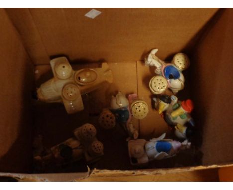 A box containing six novelty ceramic cruets including duck family, aeroplane, donkeys, etc.