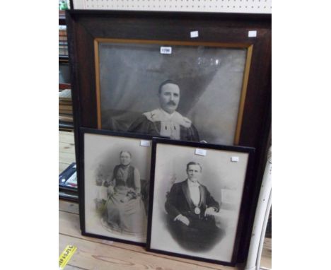 A large oak framed monochrome photograph portrait of an Alderman wearing robes of office and regalia - sold with a pair of re