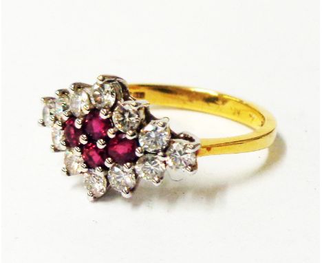 An import marked 750 gold ring with ruby and diamond cluster in marquise shaped setting - boxed