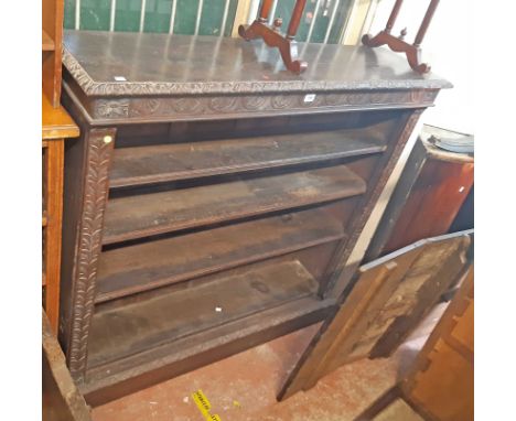 A 1.38m 19th Century carved oak four shelf open bookcase, set on plinth base